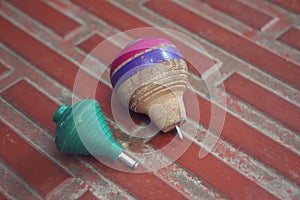 Classic wooden spinning top toy with string