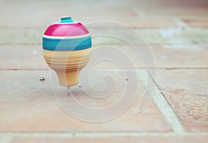 Classic wooden spinning top toy with string