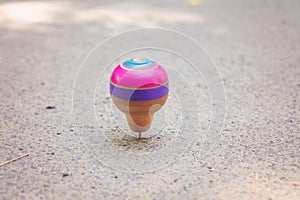 Classic wooden spinning top toy with string