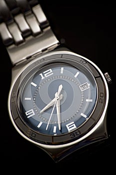 Classic wrist watch on black background