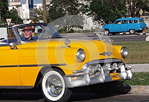 Classic Yellow Car With White Wall Tires In Havana