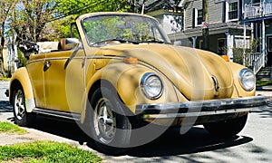 Classic yellow Volkswagen Beetle.