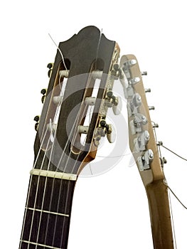 Classical acoustic guitar neck and electric guitar headstock isolated