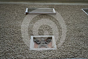 Embossed milling on the front wall of a house in the historic Siedlung Elsengrund complex. Kopenick, Berlin, Germany
