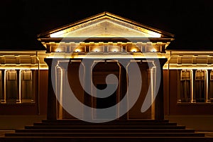 Classical architecture building with columns illuminated at night