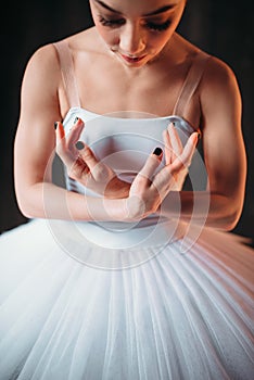 Classical ballet dancer body in white dress