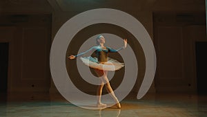 Classical ballet dancer preparing to start the performance