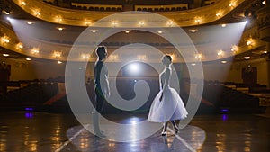 Classical ballet dancers practice on theatre stage