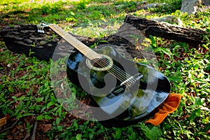 classical black guitar on the grass photo