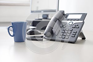 Classical black telephone in the office, customer support and telesale