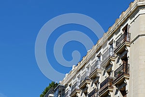 Classical building line with classy metallic balconies in Chueca district downtown Madrid, Spain photo