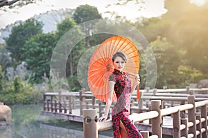 A classical Chinese woman dressed in cheongsam