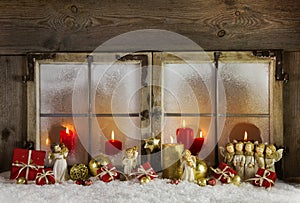 Classical christmas wooden window decoration with red candles an