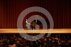 Classical, concert and woman with piano on a stage for performance, entertainment and talent show. Musician, creative