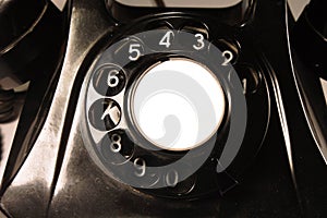 Classical dial of an old bakelite telephone. Isolated on white background