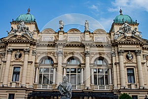 Classical facade of Juliusz Slowacki Theatre adorned with statues in Krakow, Poland