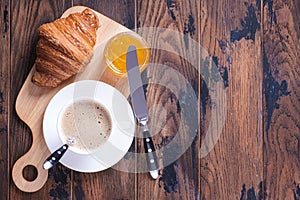 Classical french breakfast croissant and orange jam