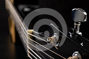 Classical guitar on a dark wooden table. Musical instrument stringed