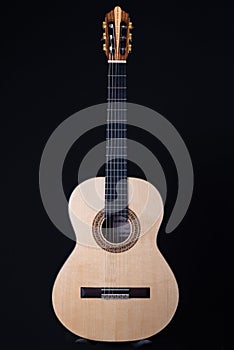 Classical guitar isolated on black background