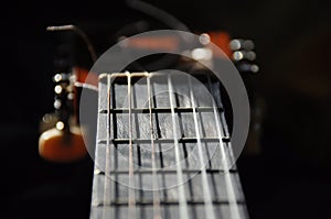 Classical guitar. Issuing a stringed instrument sounds. Fretboard, strings