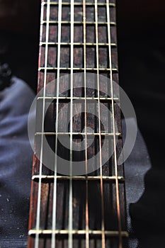 Classical guitar. Issuing a stringed instrument sounds. Fretboard, strings