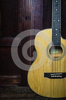 Classical guitar on old wooden background