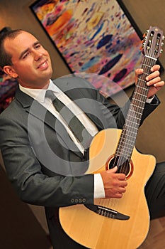 Classical guitar player Dmytro Manko performig musical set