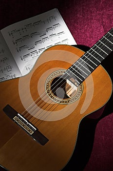 Classical guitar with sheet music