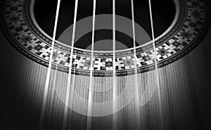 Classical guitar: strings and rosette. Black and white photo