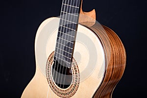 Classical guitar top  on black background