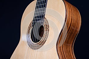 Classical guitar top  on black background