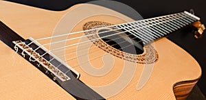 Classical guitar top isolated on black background