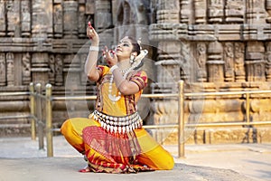 Classical Indian dancer in the posture of Indian dance. Culture of Odisha