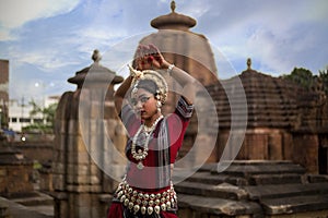 Classical Indian Odissi dance posing at Mukteshvara temple. Closeup view