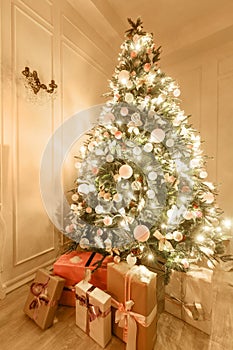 Classical interior of a white room. Christmas evening. classic apartments with a white fireplace, decorated christmas