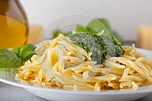 Classical italian trofie pasta with pesto sauce