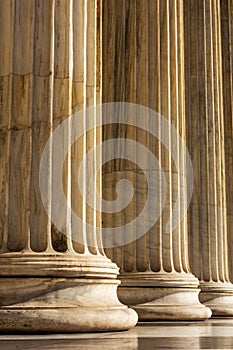 Classical marble pillars detail on the facade of a building