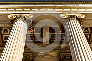 Classical marble pillars detail on the facade of a building