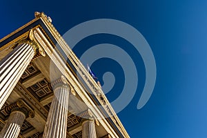 Classical marble pillars detail on the facade of a building