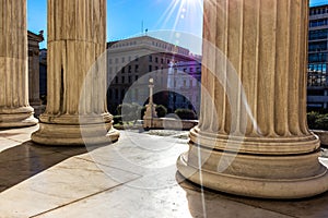 Classical marble pillars detail on the facade of a building