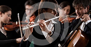 Classical music concert: flutist close-up photo