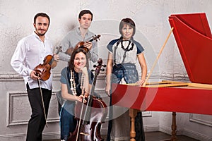 Classical music quartet posing after the concert.