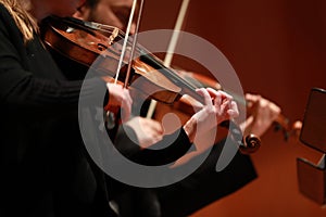 Classical music. Violinists in concert. Stringed, violinist.Closeup of musician playing the violin during a symphony