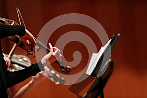 Classical music. Violinists in concert. Stringed, violinist.Closeup of musician playing the violin during a symphony