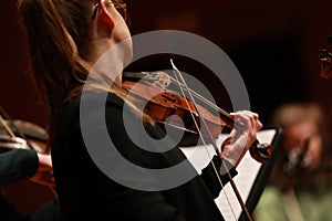 Classical music. Violinists in concert. Stringed, violinist. Closeup of musician playing the violin during a symphony