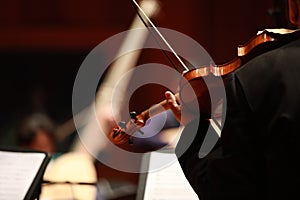 Classical music. Violinists in concert. Stringed, violinist.Closeup of musician playing the violin during a symphony