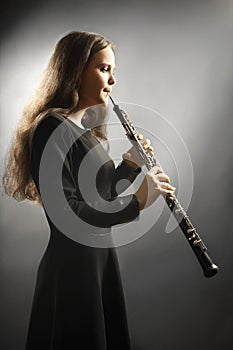 Classical musician oboe musical instrument playing. photo