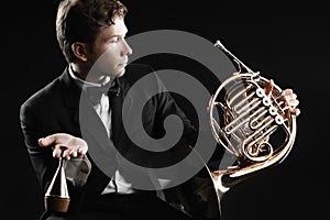 Classical musician portrait with French horn