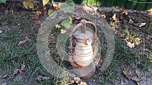 Classical old lamp. Vintage dusty kerosene lamp with dirty glass and rusting