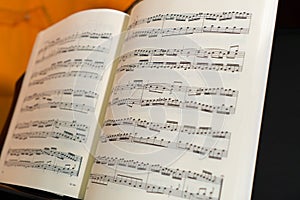 classical piece piano score, composed of ascending broken chords photo